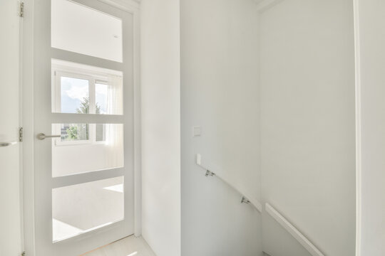 Bright white empty room with large window