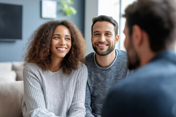Young couple smiles in therapy with a psychologist, seeking help for their relationship and mental health. They sit together, showing trust and hope