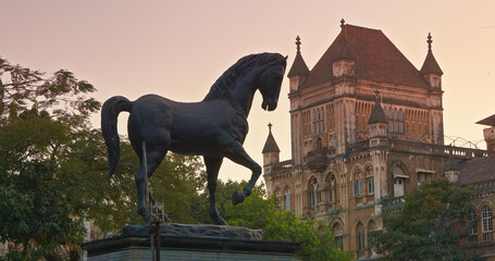 Black Bronze Kala Ghoda Statue, Horse Statue In Downtown Of Mumbai, India. Crescent-shaped Art District Neighborhood In Mumbai, India. Statue is Reference To Presence Of Black Stone Statue Of King