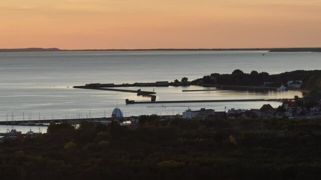 Hel city. Aerial view of Hel Peninsula in Poland, Baltic Sea and Puck Bay. Aerial video made by drone from above. End of poland hel peninsula. Hel beach in Poland. Sunset at sea and bay, Poland.
