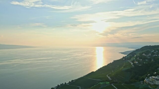 Drone shot of the sunset with the vineyards of Lavaux and the Lake of Geneva in Switzerland.