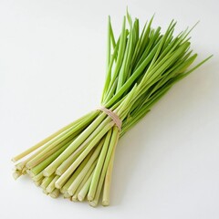 Fototapeta premium Fresh Lemongrass stalks tied together with a rubber band on a white background.
