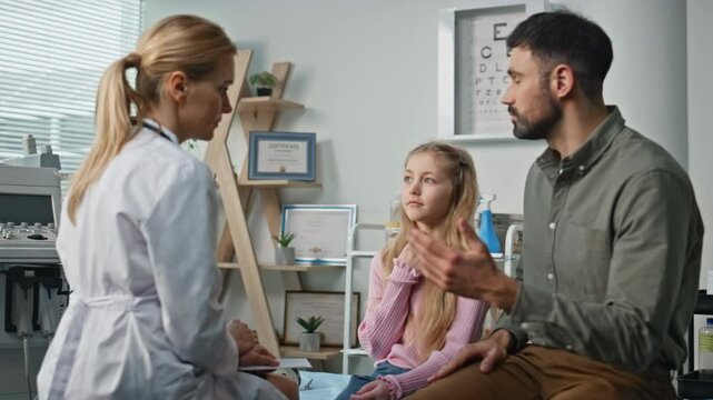 Ill child complaining practitioner about health problem. Professional doctor