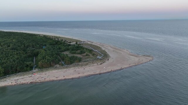 Hel city. Aerial view of Hel Peninsula in Poland, Baltic Sea and Puck Bay. Aerial video made by drone from above. End of poland hel peninsula. Hel beach in Poland. Sunset at sea and bay, Poland.