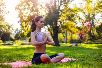 Woman Meditating Outdoors in a Peaceful Park Setting