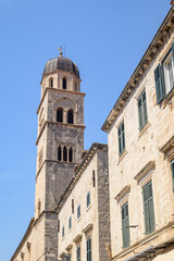 Obraz premium Church and bell tower of the Franciscan friary situated at the Stradun, the main street of Old town Dubrovnik in Croatia