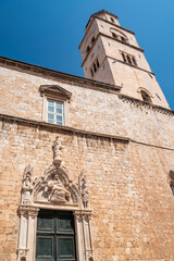 Church and bell tower of the Franciscan friary situated at the Stradun, the main street of Old town Dubrovnik in Croatia