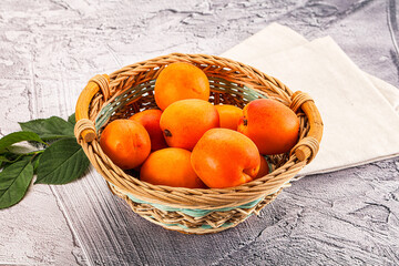 Raw ripe sweet apricots heap