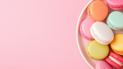 Fototapeta premium Colorful Macarons on Pink Background with Copy Space