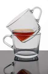 two cups of tea stand one in the other