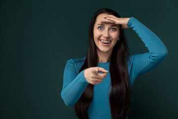 Woman With Long Black Hair Holding Hands Up to Face
