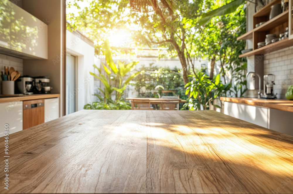 Aufkleber empty wooden kitchen table with a sunlit garden view through the window a blurred background for pro