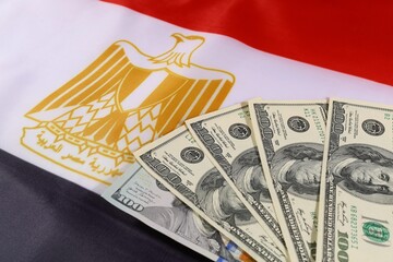 Cash and currency on the Egyptian flag symbolizing economy and finance