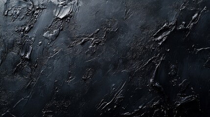 A dark, textured abstract background with a rough, uneven surface. The texture creates a sense of depth and dimension, perfect for adding visual interest to design projects. It evokes feelings of myst