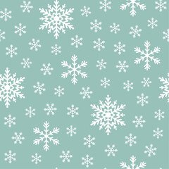 Seamless winter christmas pattern with white and green snowflakes design.
