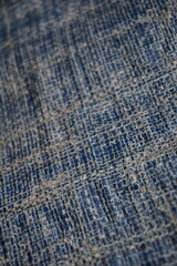 Blue grungy background with light shade tent surface, Rugged uneven material texture backdrop design, stripped particle weathered blue tent background