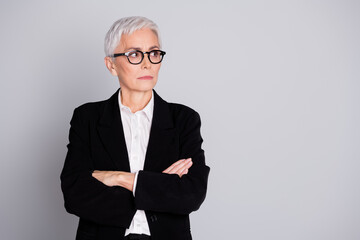 Photo of attractive mature woman professional ceo crossed hands look empty space dressed formalwear...