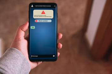 Woman receives message from suspected number scam. Unwanted anonymous call. Fraud and phishing phone concept. Message from stranger.