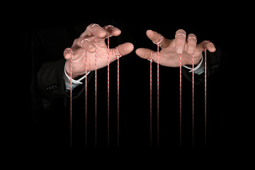 Obeying master  hand pulling the strings. Concept of emotional manipulation, world conspiracy...