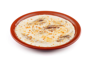 Delicious baked fish with cream cheese sauce on plate