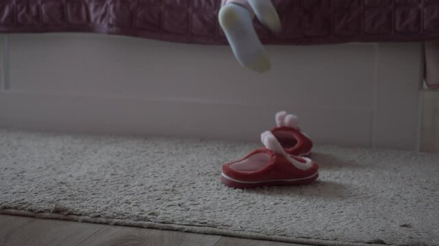 the child climbed on the bed, the little girl went to sleep on the bed, took off her  slippers and climbed into the bed