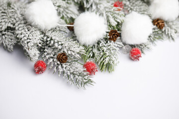 Winter border made of Christmas red berries and gift decoration on white background. Xmas and New Year holiday card