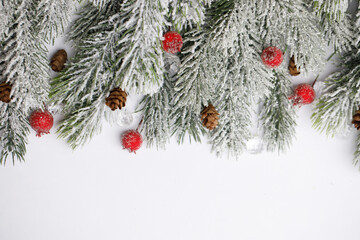 Christmas decoration background border on white. Holiday card with winter fir tree ornament