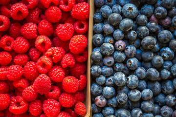 Blueberries and raspberries background