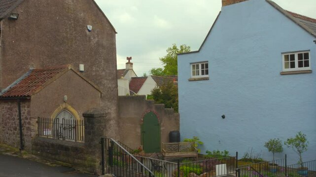 Residential Buildings In Quaint Town Of Axbridge In Somerset, England. panning shot