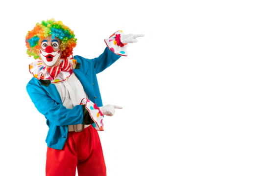 Surprised clown pointing at blank template copy spase for advertising, posters, greetings, invitations. Entertainer as Joker in a suit and wig, with clown whiteface makeup.