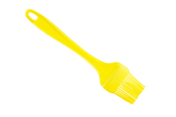 Silicone basting pastry brush, yellow cooking Brush, kitchen equipment tool on isolated background.