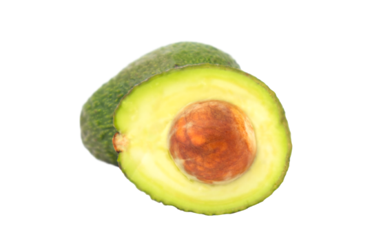 Fresh avocado halved on clean white surface