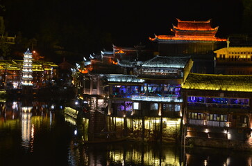 Fototapeta premium night view of ancient Fenghuang town with stilted building