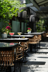 Martini glass cocktails served on restaurant table. Margarita and Cosmopolitan cocktail with olive