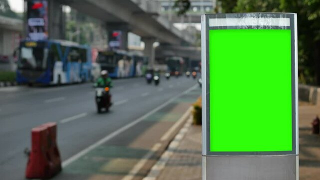 Green wrinkled poster template in city. Glued paper mockup. Empty street art sticker mock up. Clear urban glued advertising canvas. Billboard advertisment advertiser.