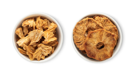 Bowl plates with sweet dried pineapple pieces and circles isolated on white background.Top view.