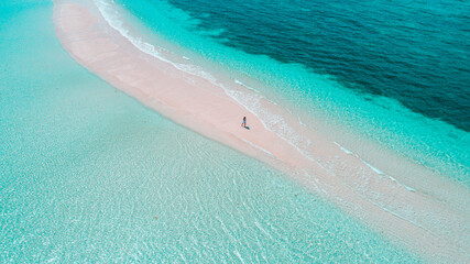A Maldives sandbank with calm turquoise waters and white sands, creating a relaxing summer holiday vibe.