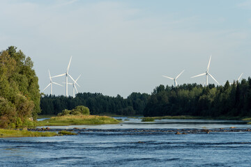 A wind farm in beautiful river landscape, Northern Finland