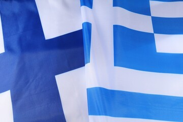 Greek flags waving gently in the breeze on a sunny day