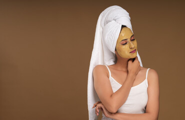 portraits of a young woman with face pack