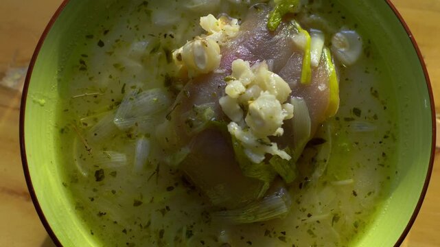 Delicious dish of caldo de pata de vaca prepared in the Ecuadorian highlands, served in a bowl