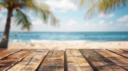 Fototapeta premium Blurred background of tropical beach with wooden table for product ad - Summer relaxation montage