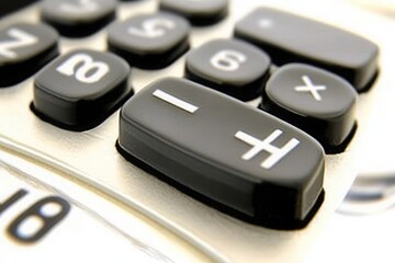 Close-up of a Calculator with Plus and Minus Keys