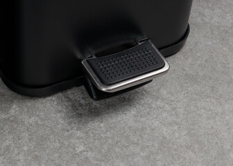 Close-Up of Pedal Bin Foot Mechanism on Grey Floor