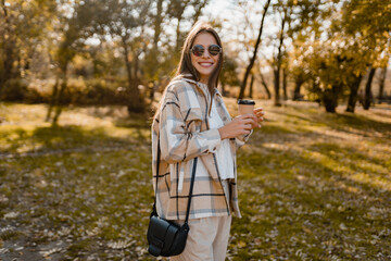 attractive young woman walking in autumn wearing jacket