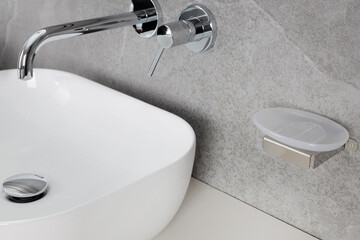 Minimalist Bathroom with Empty Soap Dish and Chrome Faucet