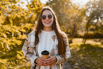 attractive young woman walking in autumn wearing jacket