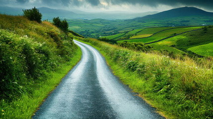 Fototapeta premium Lush green road in the heart of the Irish countryside, surrounded by rolling hills.