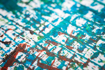 Extreme close up of colorful acrylic paint texture showing brush strokes. Selective focus.