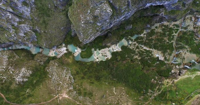Beautiful drone shot of the turquoise waters of Millpu, Ayacucho, Peru during a cloudy day.